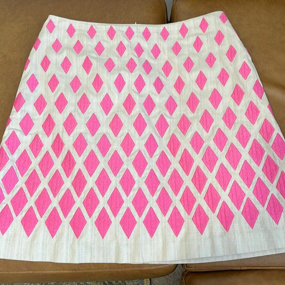 BODEN - A-Lined skirt with pink diamonds, side pockets and zipper back closure.